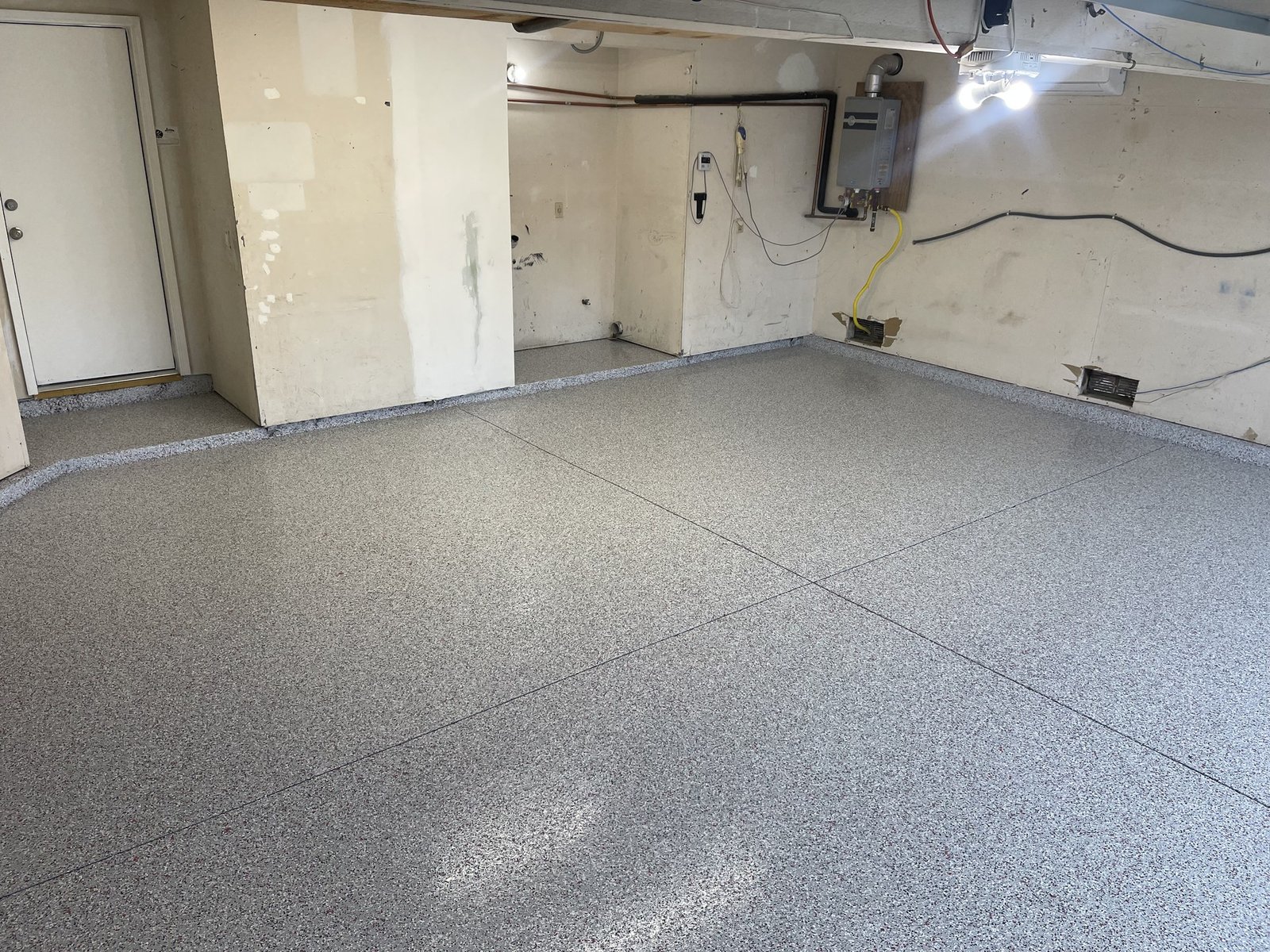 Gray flake epoxy garage floor coating with a high-gloss topcoat