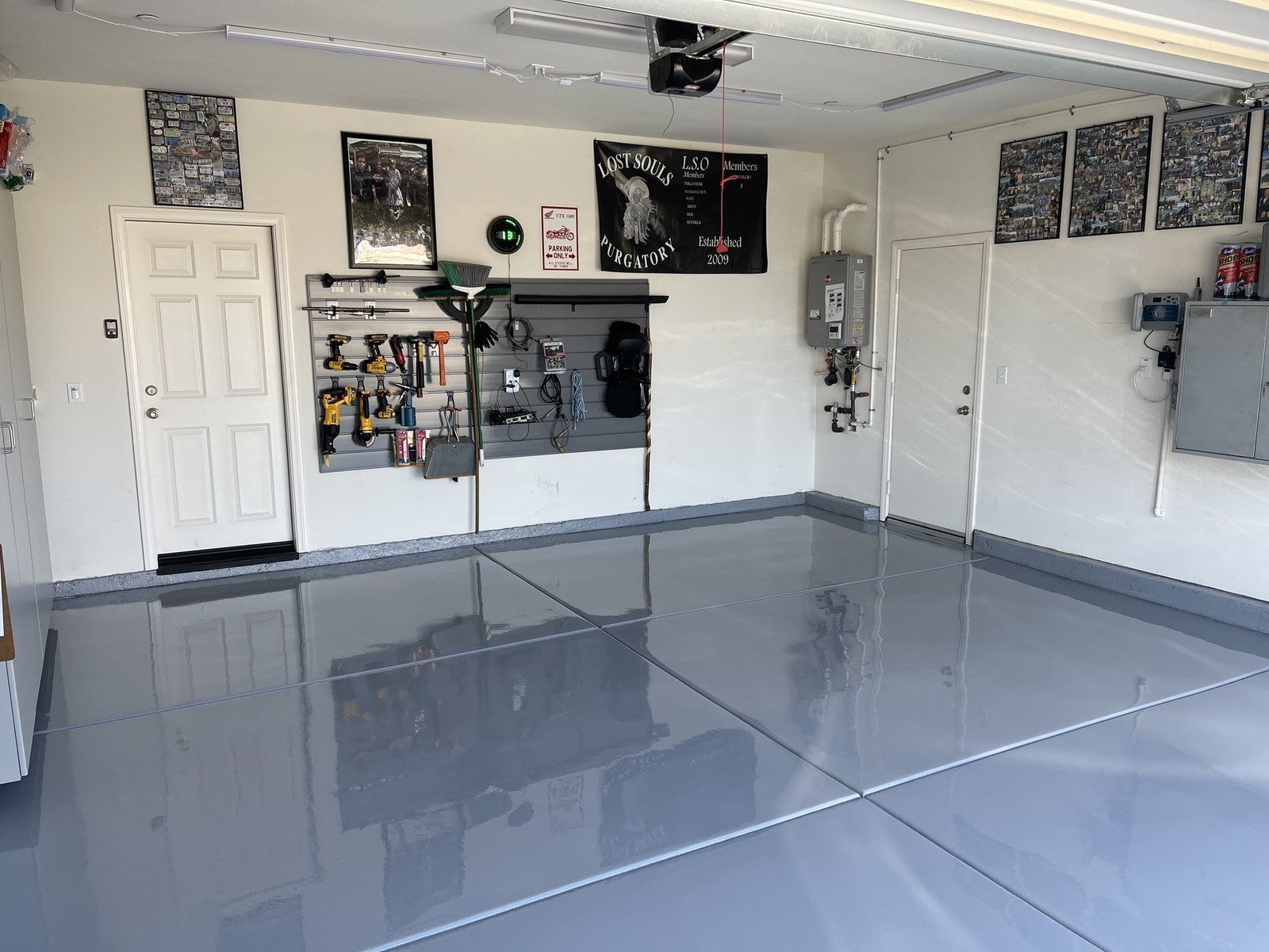 Solid-color gray epoxy garage floor with a glossy finish